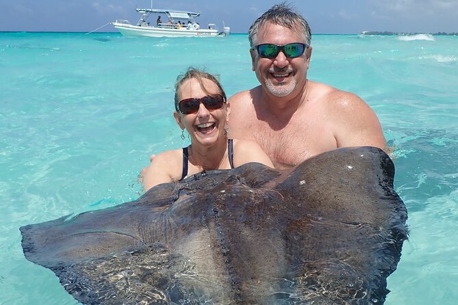 (Family owned) Stingray city sandbar, Starfish Beach & Snorkeling - The Stingray City moment, feeding and handling without the chaos