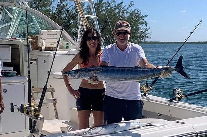 Luxury Private Fishing Charters - FULL DAY CHARTER - Reef fishing in North Sound for barracuda, snapper, jacks, and triggerfish