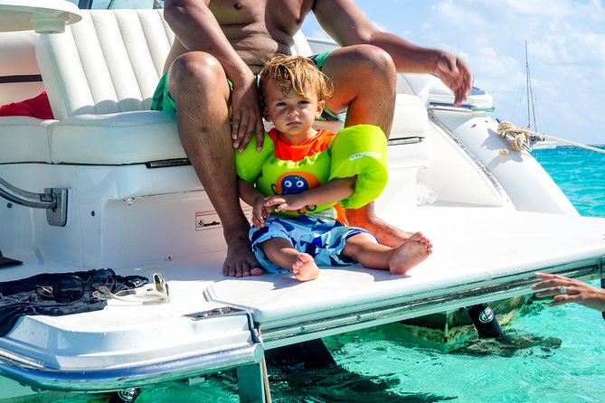 Private, luxury, custom charters to Stingray City, Snorkeling & More - Starfish Point and the Red Cushion Sea Star beach moment