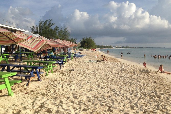 Seven Mile Beach Getaway - Getting there from George Town: AMVIVO sign, tender timing, and island time