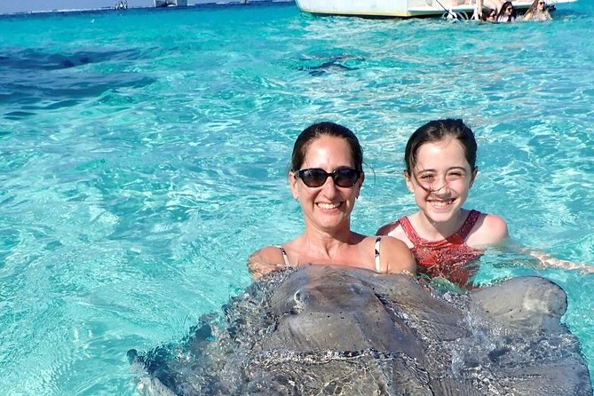 Stingray City Experience Plus One Snorkeling Stop - Captain Marvins Watersports and the crew experience on the cabin cruiser